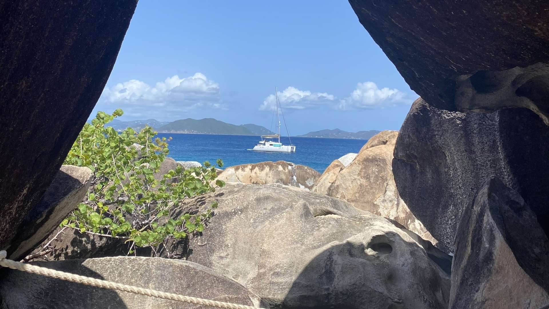 Great Adventure framed by shoreline boulders
