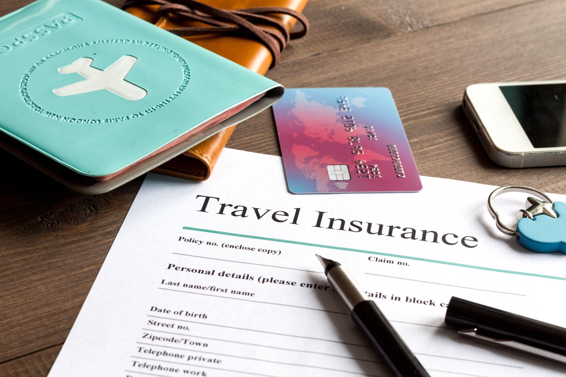 Travel insurance paperwork and essentials for a trip